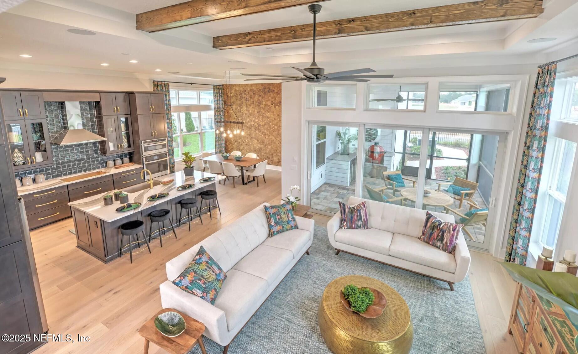 903 Someruelus Street Fernandina Beach, FL 32034 - Photo 15 of 31 a living room with furniture and a large window