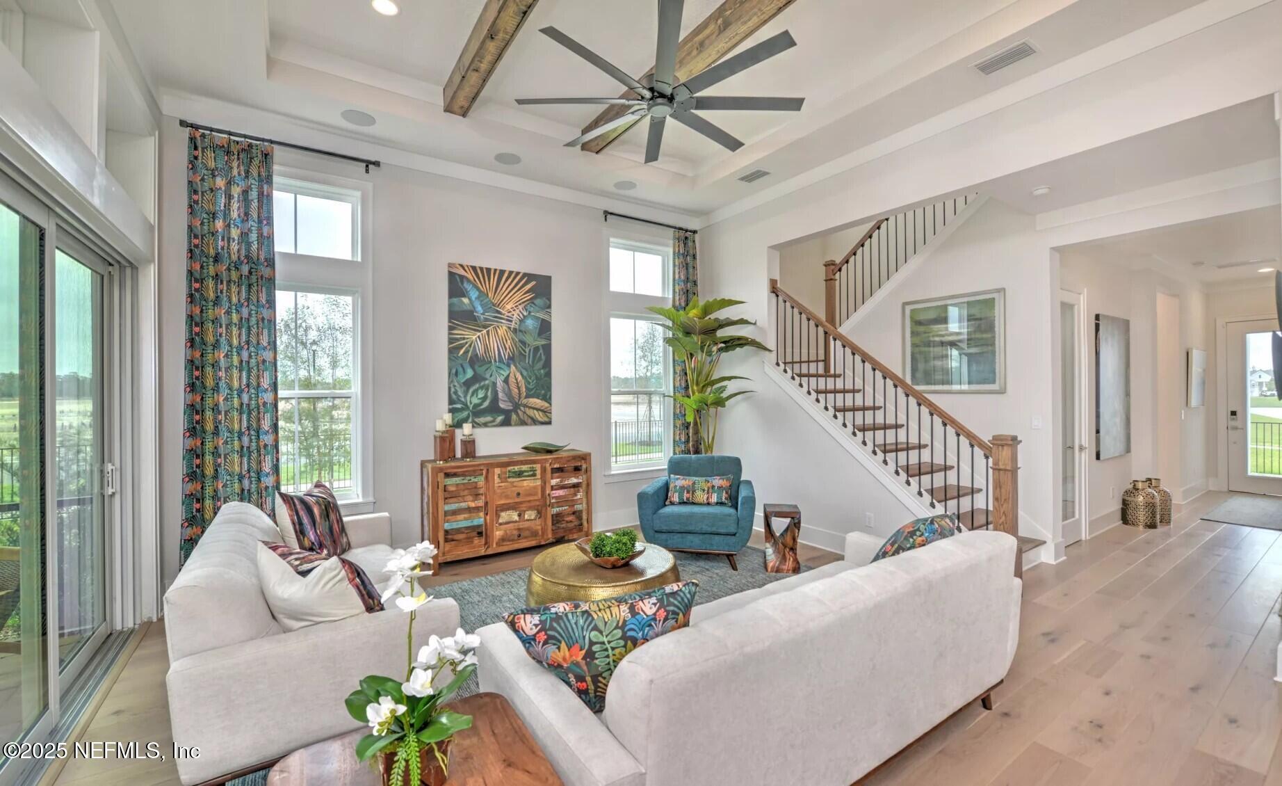 903 Someruelus Street Fernandina Beach, FL 32034 - Photo 2 of 31 a living room with furniture and a large window
