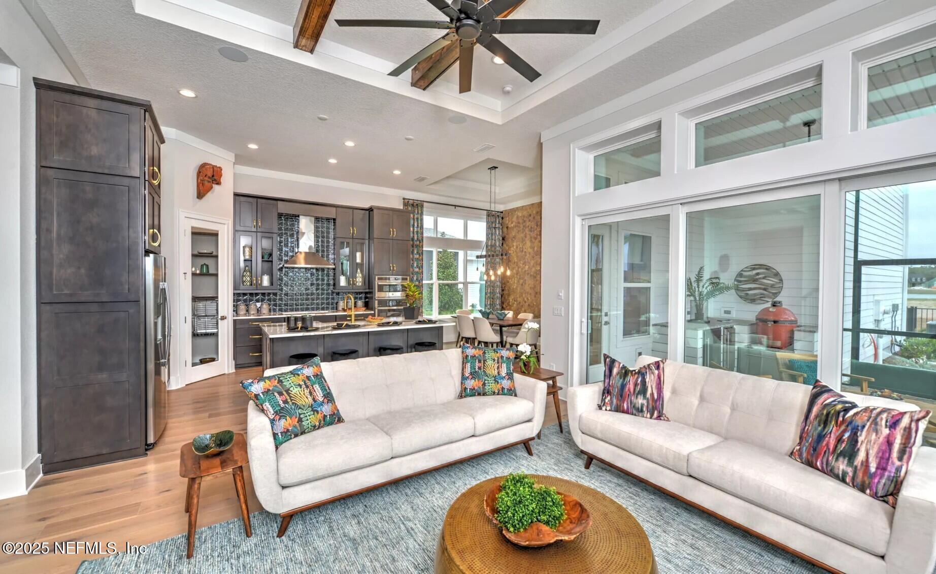 903 Someruelus Street Fernandina Beach, FL 32034 - Photo 5 of 31 a living room with furniture and a large window