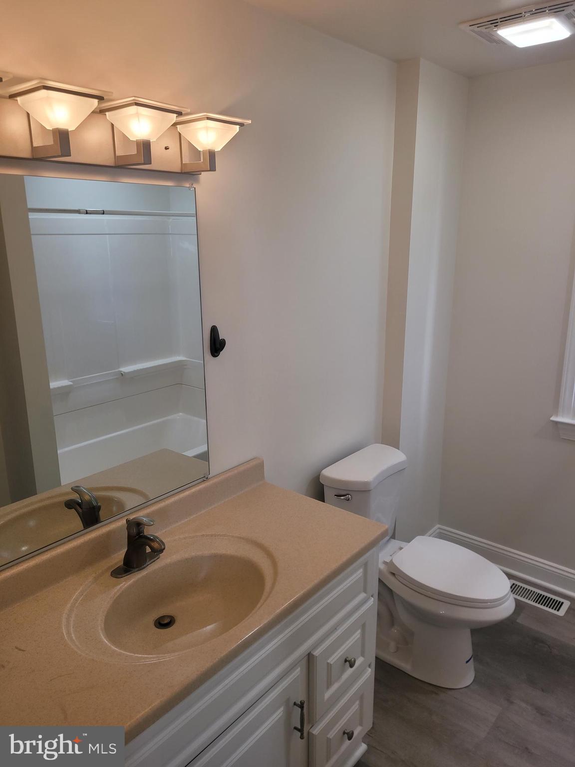 48 Webster Street Westminster, MD 21157 - Photo 13 of 25 a bathroom with a sink and a toilet