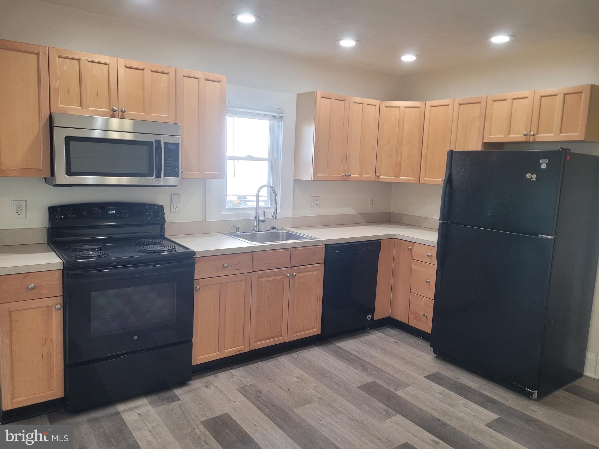 48 Webster Street Westminster, MD 21157 - Photo 2 of 25 a kitchen with a refrigerator sink and microwave