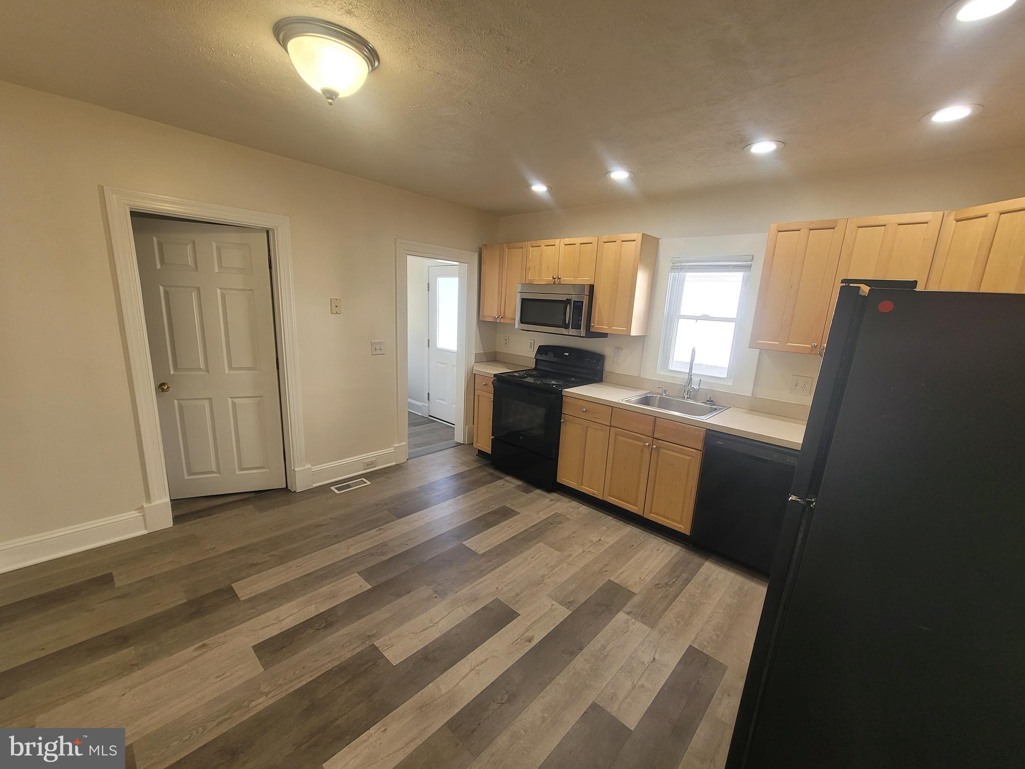 48 Webster Street Westminster, MD 21157 - Photo 4 of 25 a kitchen with a refrigerator and a sink