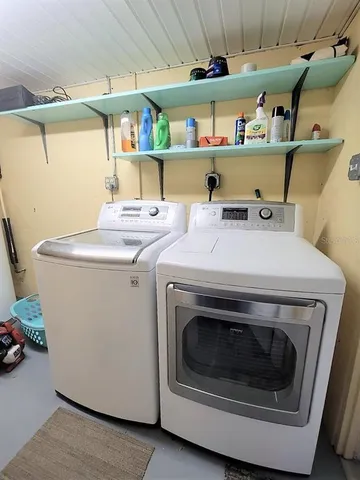 a utility room with dryer and washer