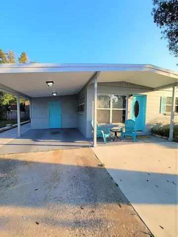 a view of swimming pool with outdoor seating