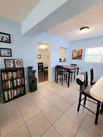 a view of a workspace with furniture and window