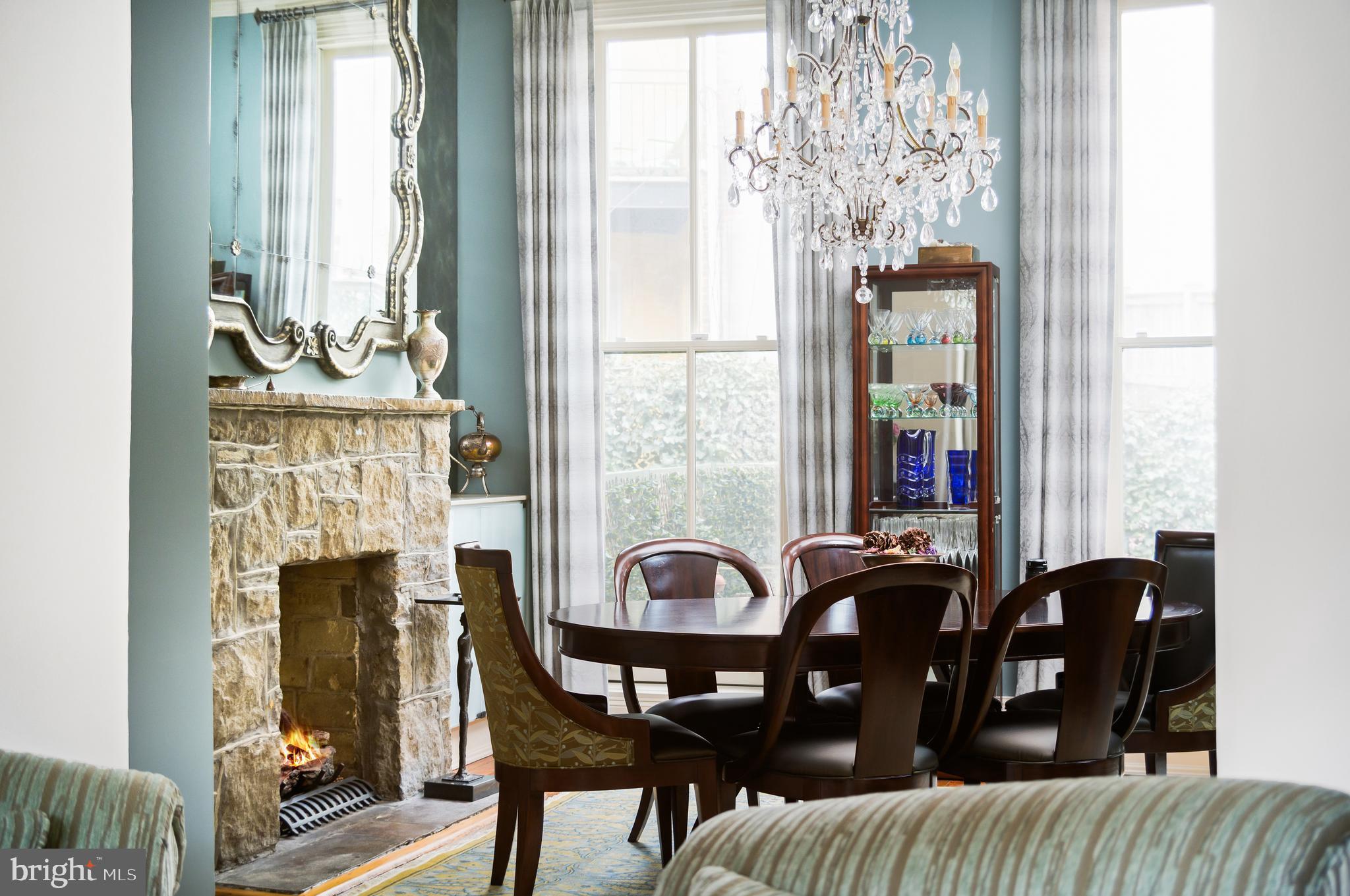 1335 Vermont Avenue Northwest Washington, DC 20005 - Photo 12 of 47 a view of a dining room with furniture and chandelier