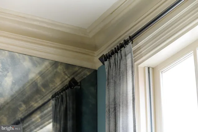 a view of a dining room with furniture wooden floor and chandelier
