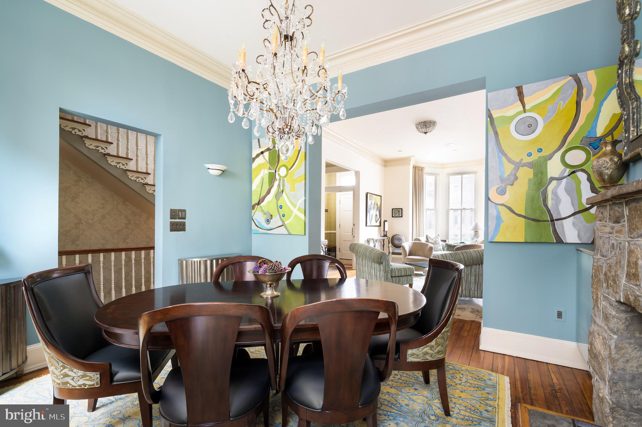 1335 Vermont Avenue Northwest Washington, DC 20005 - Photo 16 of 47 a view of a dining room with furniture and a chandelier