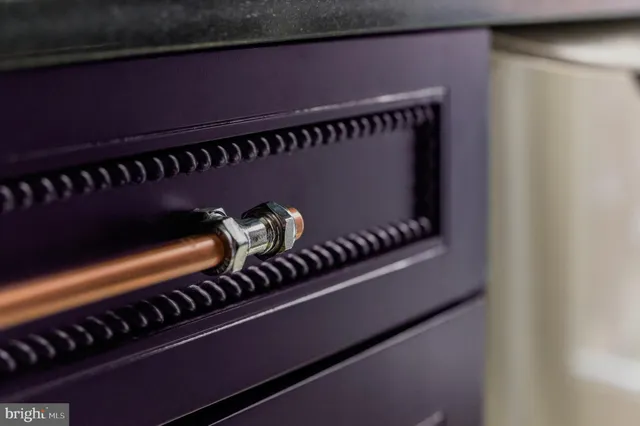 a bedroom with a bed and a large window with outer view