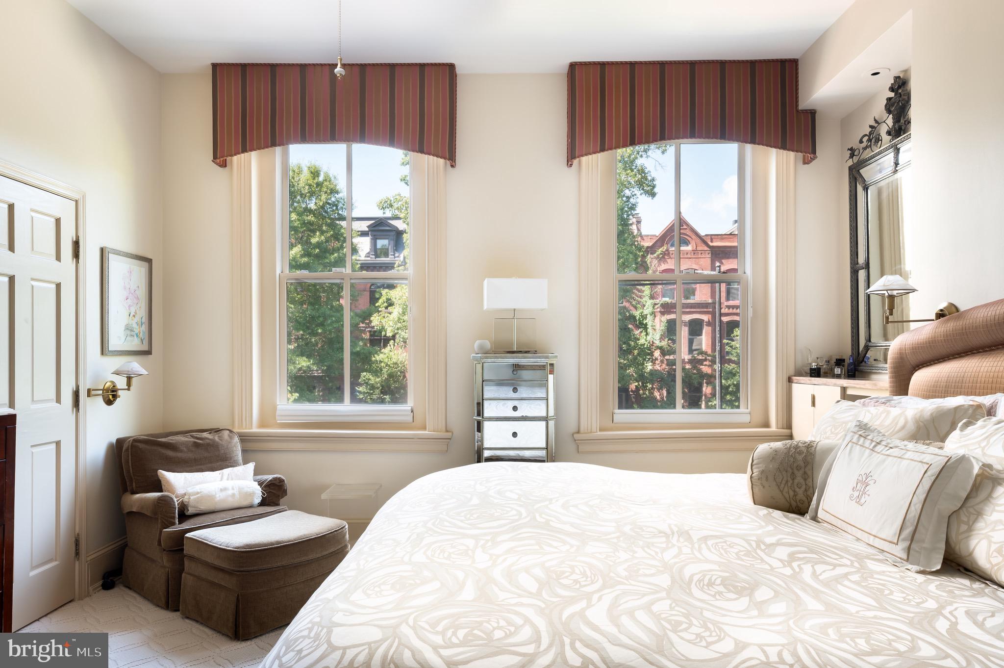 1335 Vermont Avenue Northwest Washington, DC 20005 - Photo 24 of 47 a bedroom with a bed and a large window with outer view