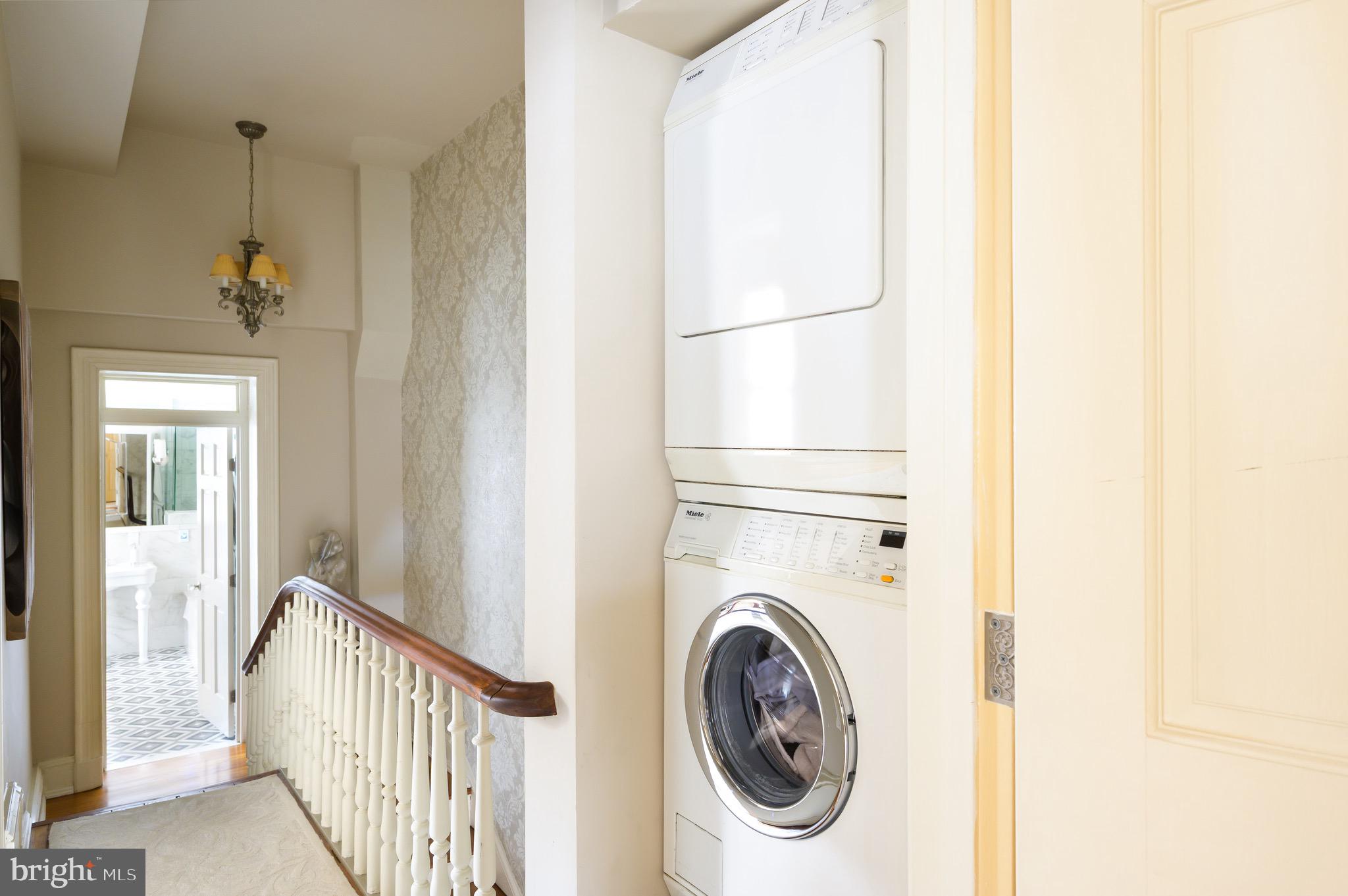 1335 Vermont Avenue Northwest Washington, DC 20005 - Photo 28 of 47 a view of a hallway with washer and dryer