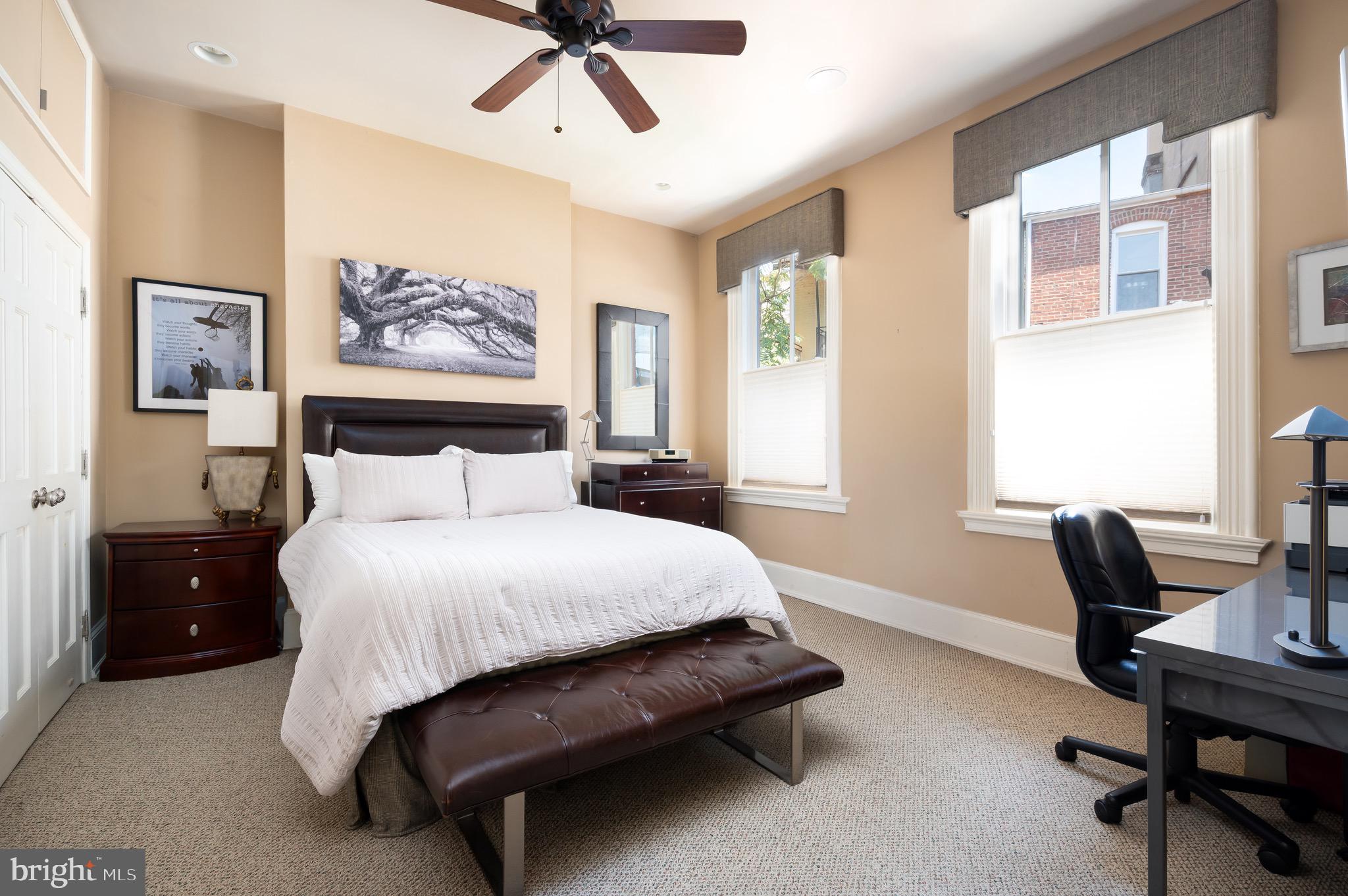 1335 Vermont Avenue Northwest Washington, DC 20005 - Photo 29 of 47 a bedroom with a bed and a desk