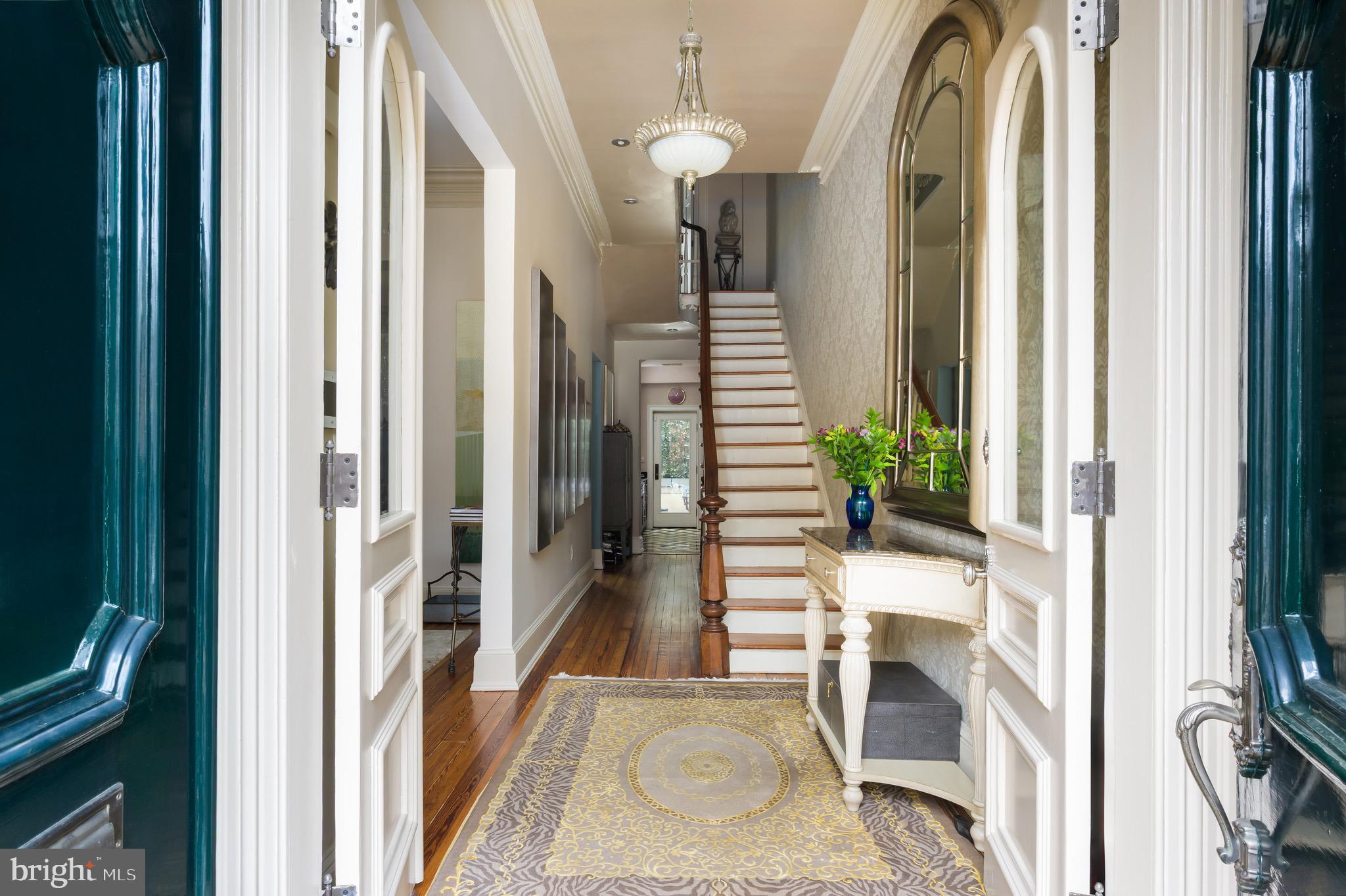 1335 Vermont Avenue Northwest Washington, DC 20005 - Photo 3 of 47 a view of a hallway with wooden floor and staircase