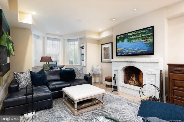 a bedroom with a bed a wall painting and a furniture