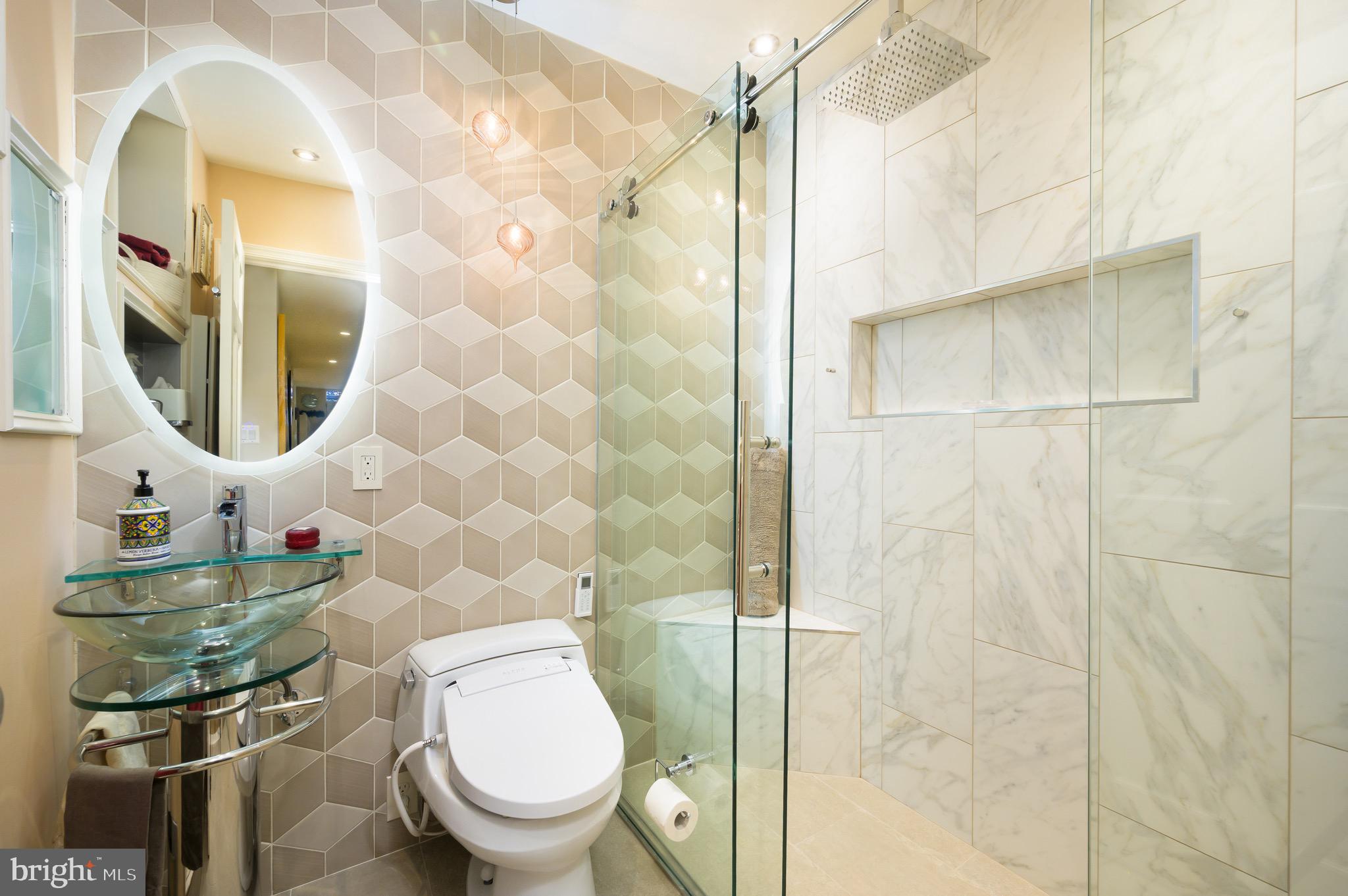 1335 Vermont Avenue Northwest Washington, DC 20005 - Photo 42 of 47 a bathroom with a toilet and a sink