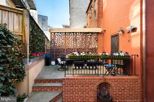 a view of a patio in a backyard