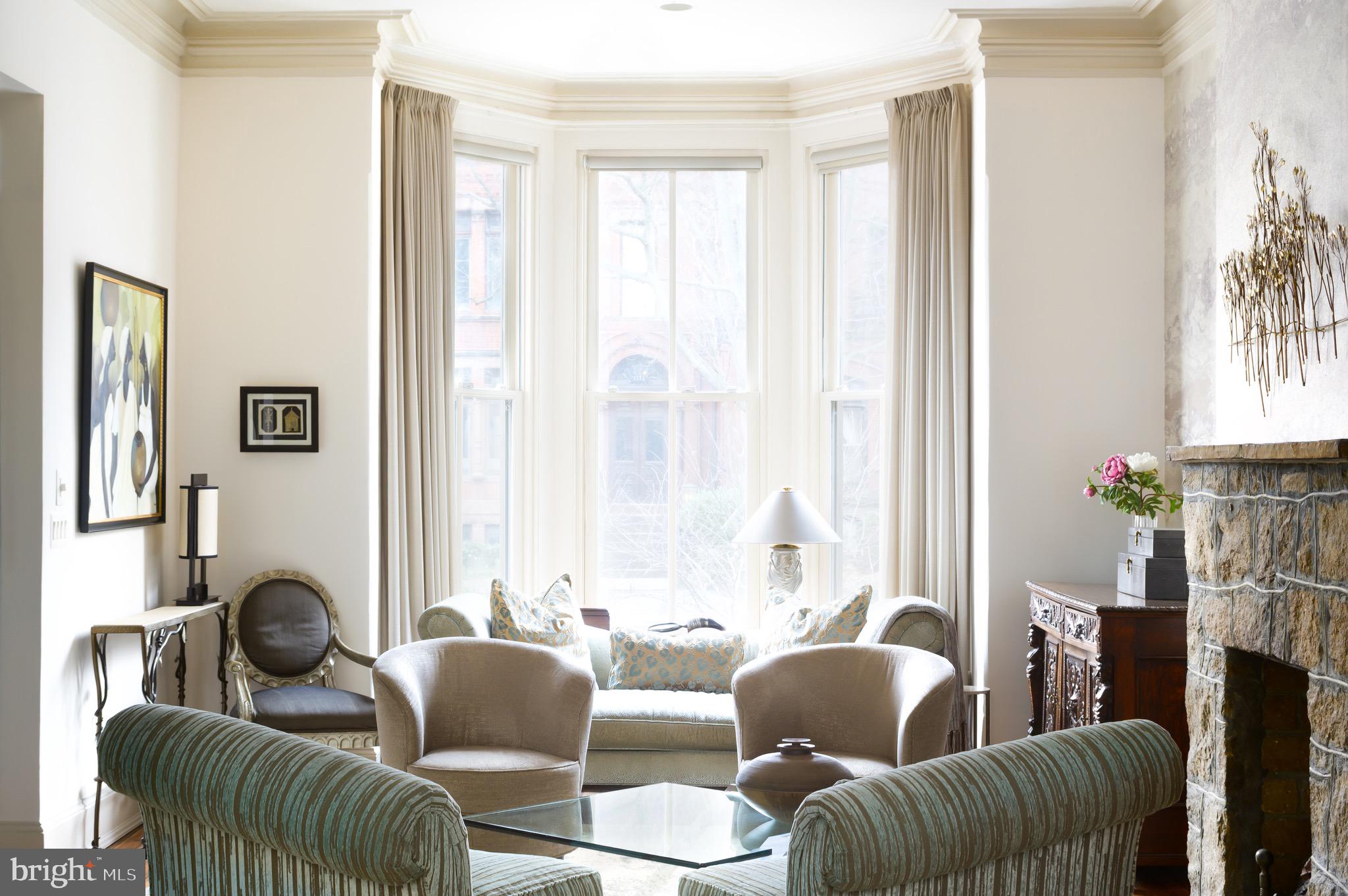 1335 Vermont Avenue Northwest Washington, DC 20005 - Photo 8 of 47 a living room with furniture and a large window