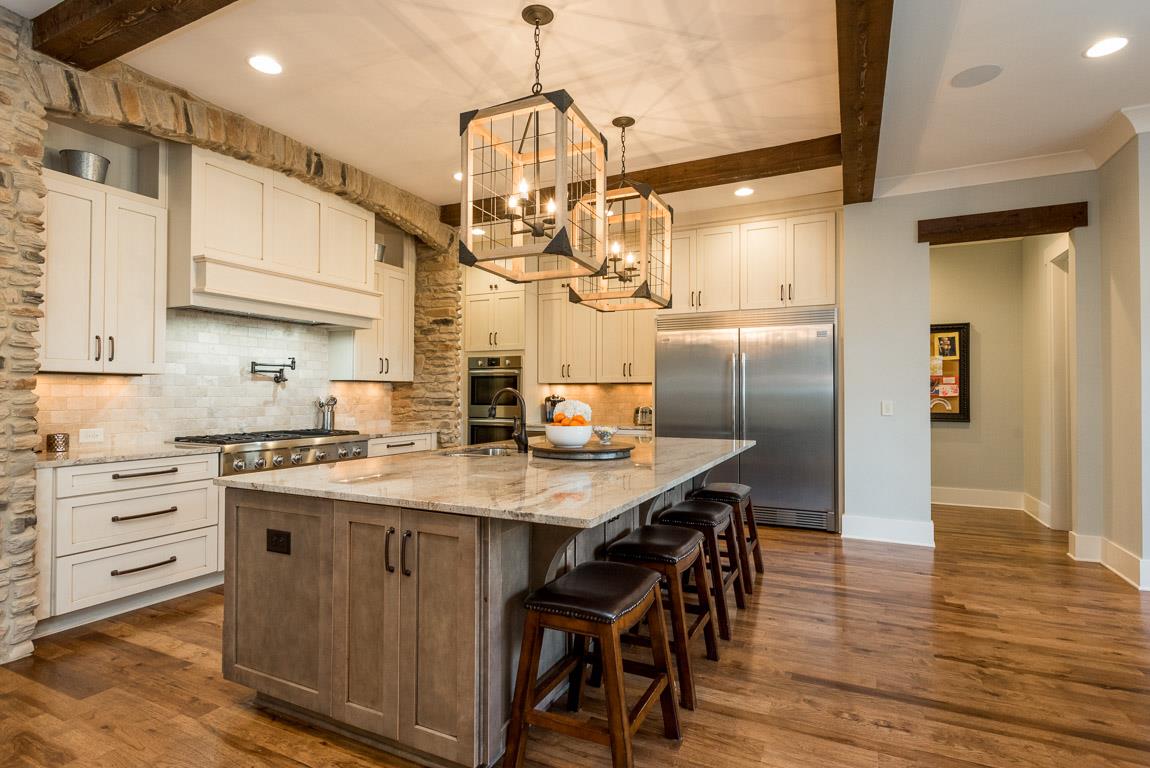 641 Legends Crest Drive Franklin, TN 37069 - Photo 13 of 30 a kitchen with kitchen island a wooden floor and white appliances