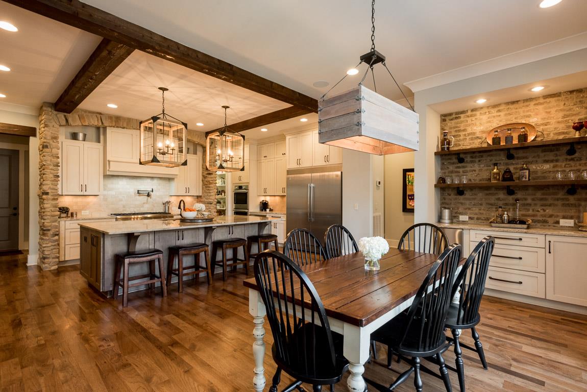 641 Legends Crest Drive Franklin, TN 37069 - Photo 14 of 30 a dining room with stainless steel appliances kitchen island granite countertop a dining table and chairs