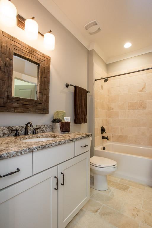 641 Legends Crest Drive Franklin, TN 37069 - Photo 23 of 30 a bathroom with a granite countertop sink toilet mirror and bathtub