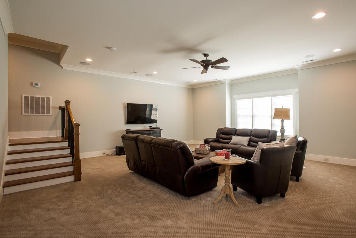 641 Legends Crest Drive Franklin, TN 37069 - Photo 24 of 30 a living room with furniture and a flat screen tv