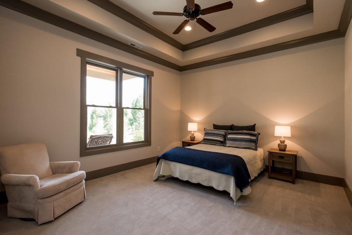 641 Legends Crest Drive Franklin, TN 37069 - Photo 27 of 30 a bedroom with a bed couch and window