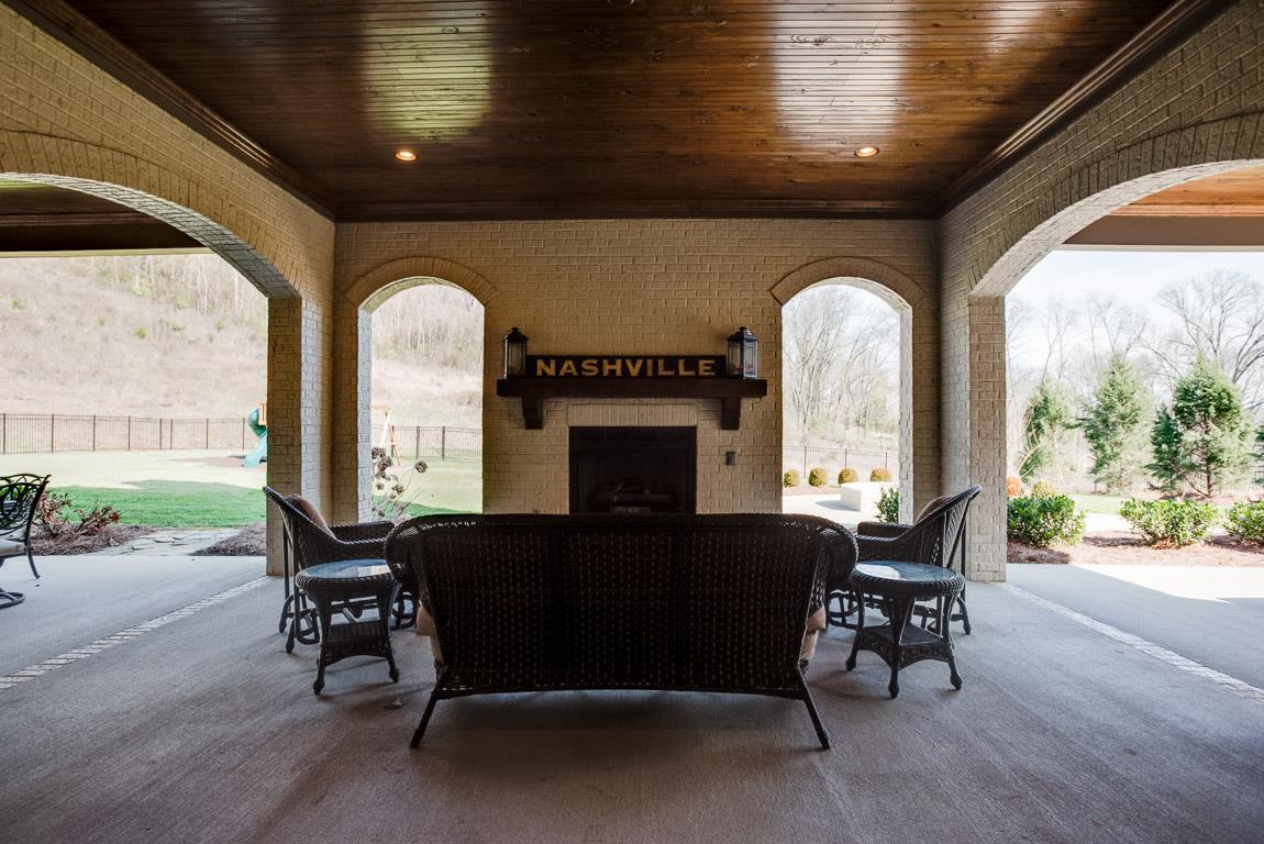 641 Legends Crest Drive Franklin, TN 37069 - Photo 30 of 30 a living room with furniture a fireplace and a floor to ceiling window