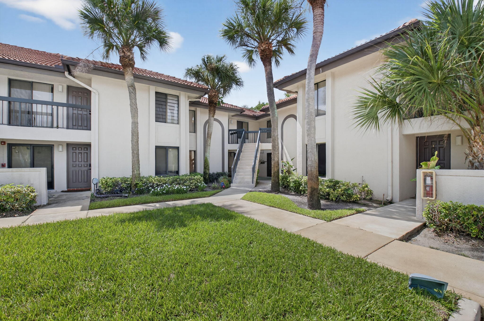 a front view of house and yard with green space