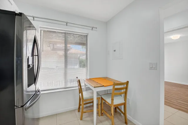 a dining room with a table and chairs