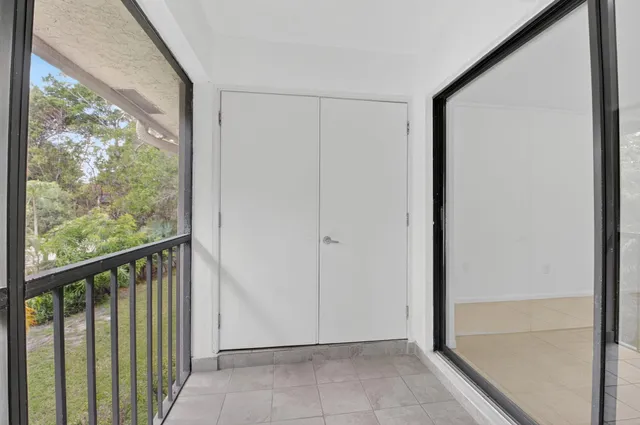 a utility room with cabinets washer and dryer