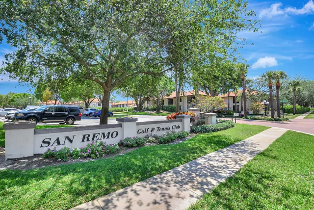 an aerial view of a house with swimming pool and garden