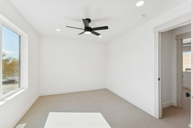 252 North Main Street Bountiful, UT 84010 - Photo 25 of 34 Spare room featuring light colored carpet, a ceiling fan, and recessed lighting