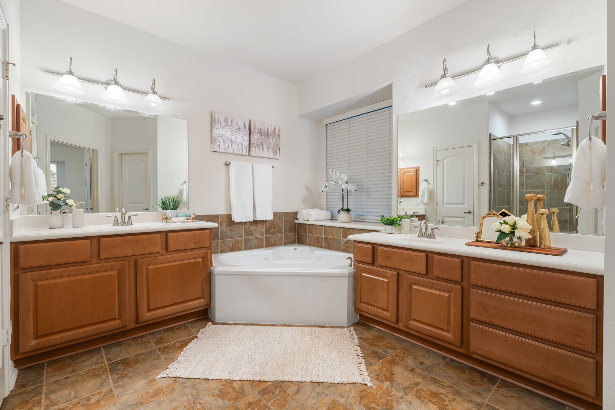 307 Arbor Ridge Lane Conroe, TX 77384 - Photo 21 of 50 a spacious bathroom with a tub sink and mirror