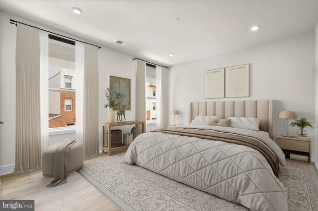 a bed room with a bed and a window