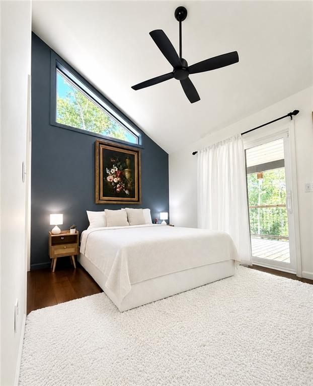 191 Oakwood Road Blairsville, GA 30512 - Photo 25 of 43 a bedroom with a large bed and a large window