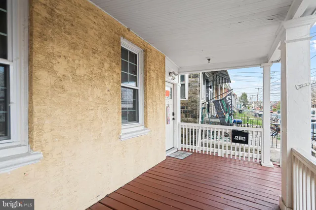 a large kitchen with kitchen island a large counter space a sink appliances and living room view