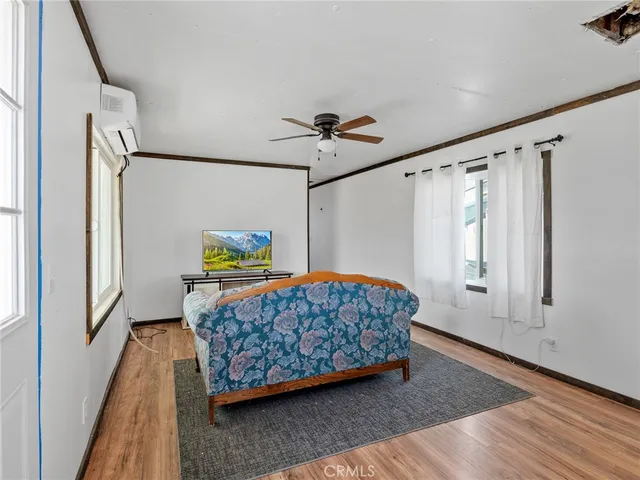 a kitchen with a sink a refrigerator and cabinets