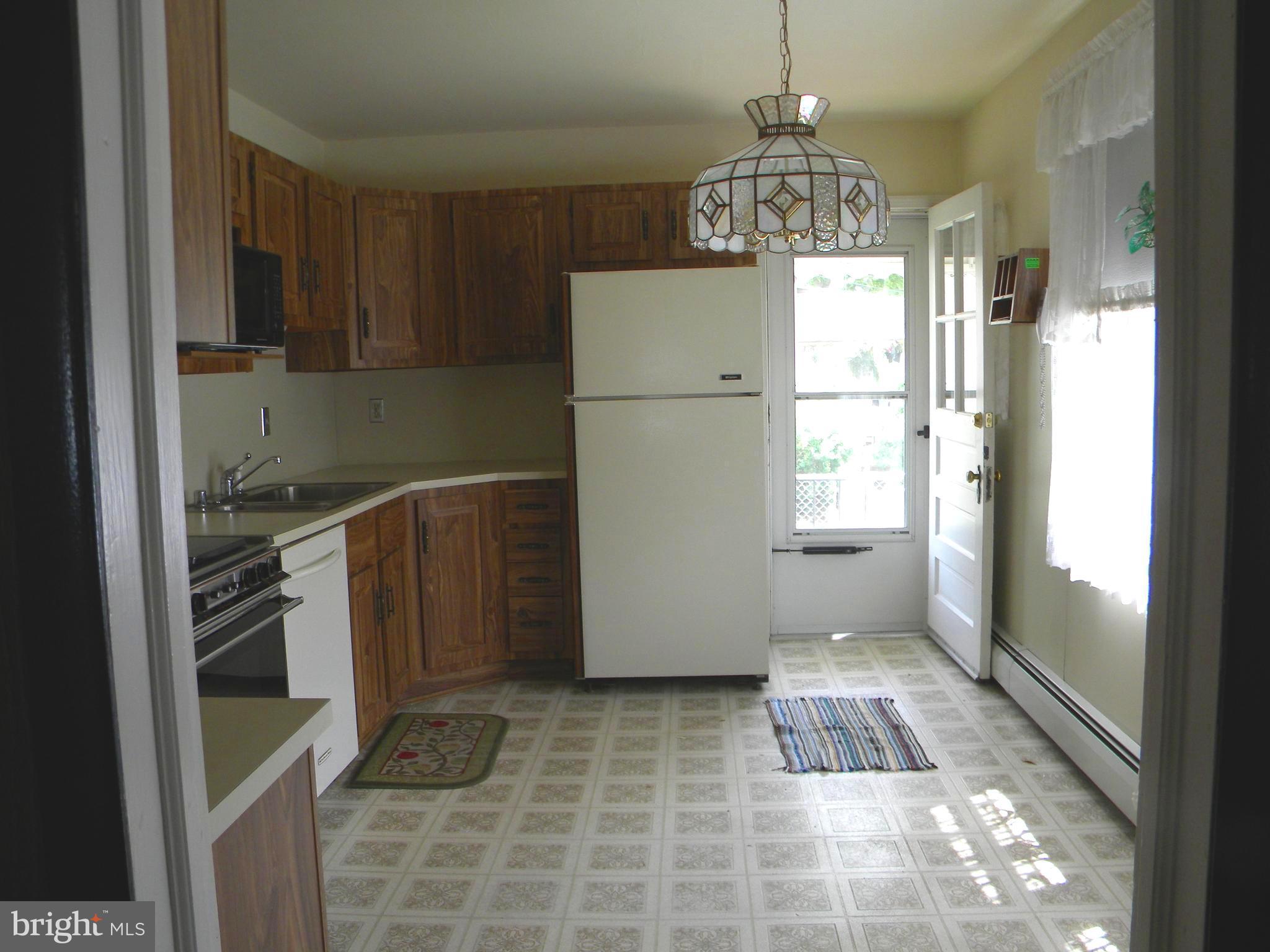 930 Kinwat Avenue Baltimore, MD 21221 - Photo 12 of 30 view from living room into kitchen