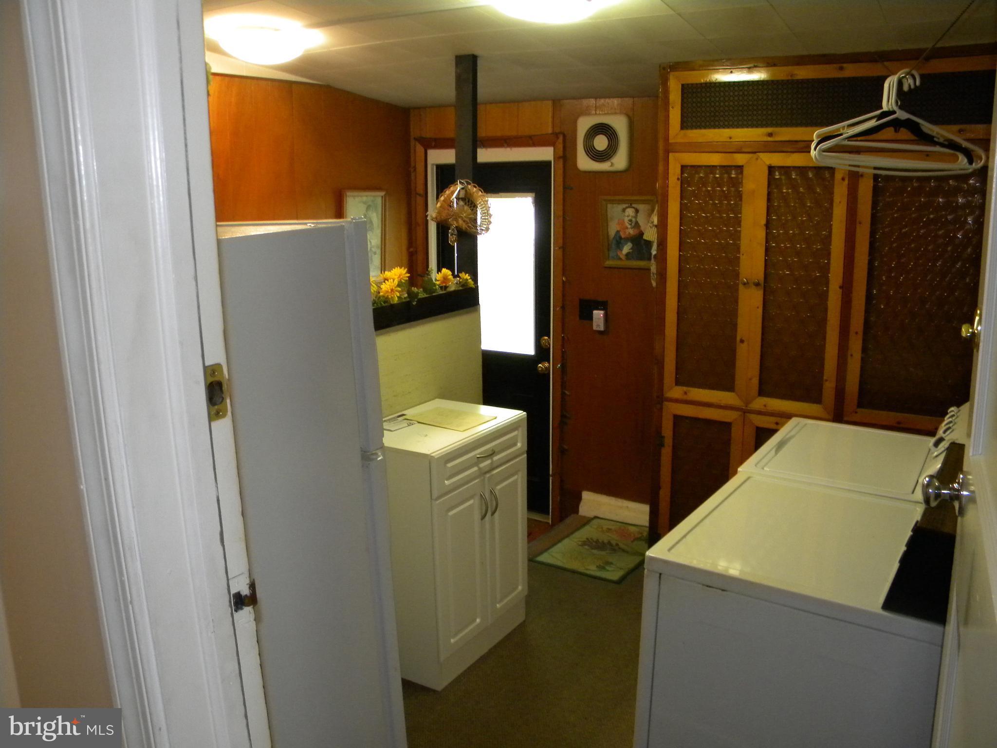 930 Kinwat Avenue Baltimore, MD 21221 - Photo 17 of 30 Laundry room off bedroom 2 and view of back door