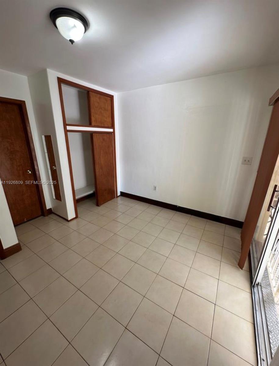 3894 Northwest 5th Street, Unit 3 Miami, FL 33126 - Photo 4 of 10 a view of a garage