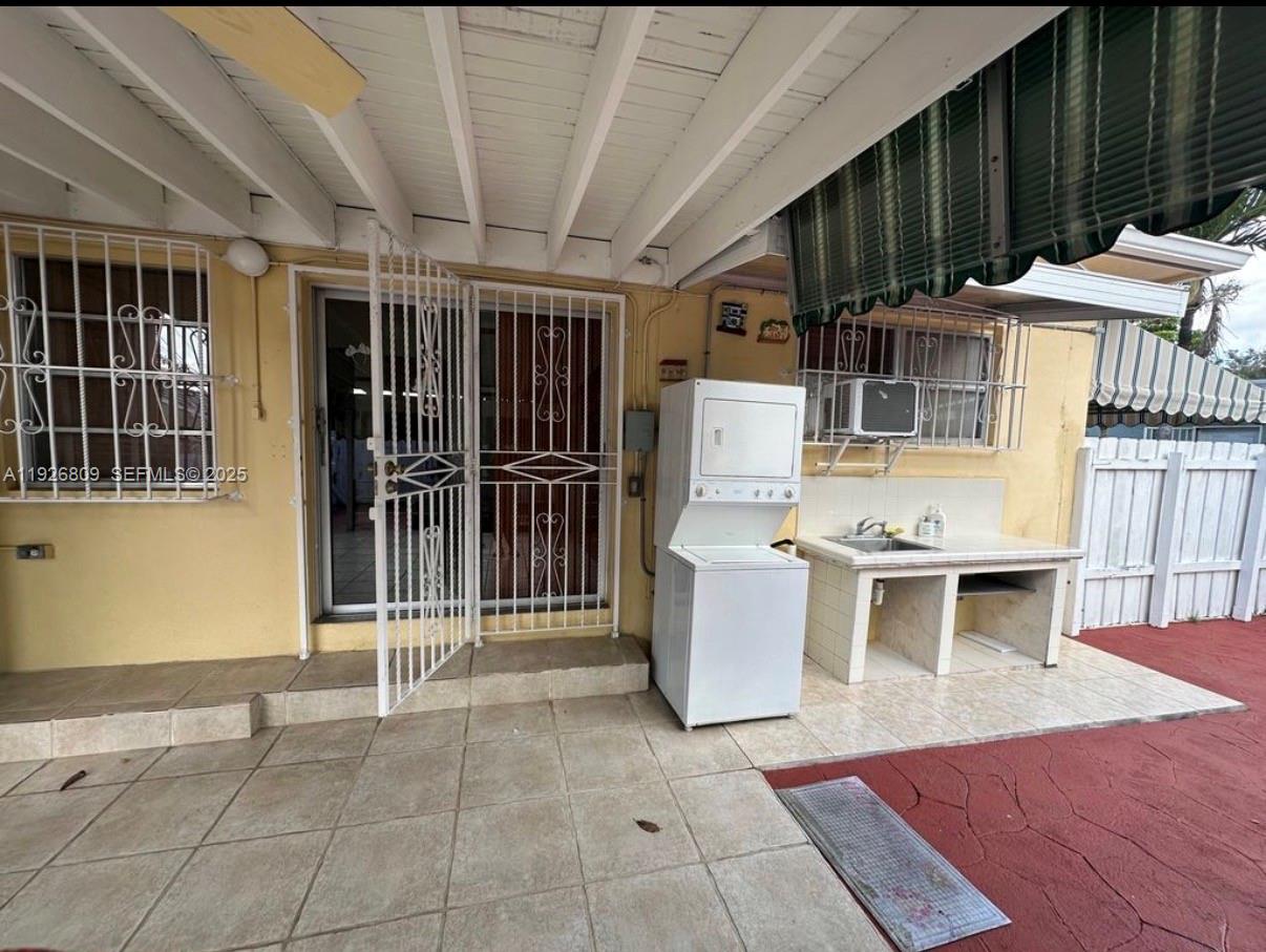 3894 Northwest 5th Street, Unit 3 Miami, FL 33126 - Photo 7 of 10 a view of a dinning room with wooden floor