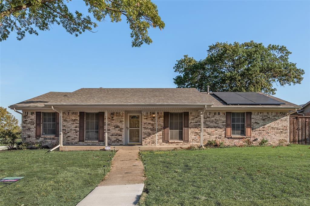 1432 Mt Vernon Drive Mesquite, TX 75149 - Photo 1 of 15 a front view of a house with garden