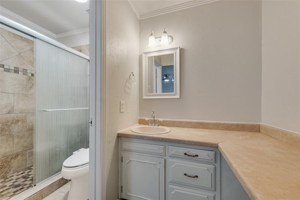 1432 Mt Vernon Drive Mesquite, TX 75149 - Photo 13 of 15 a bathroom with a sink toilet and shower
