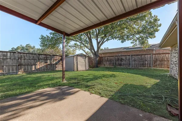 a view of a backyard with a garden
