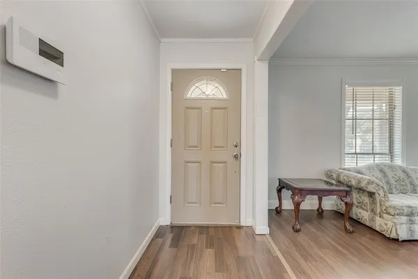 a view of a livingroom with furniture and windows
