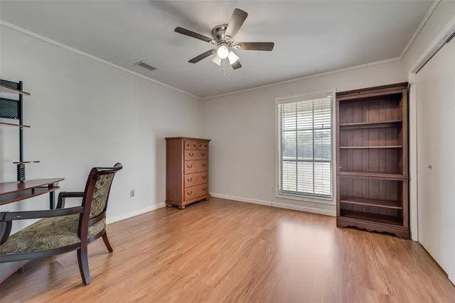 a view of workspace with furniture and wooden floor