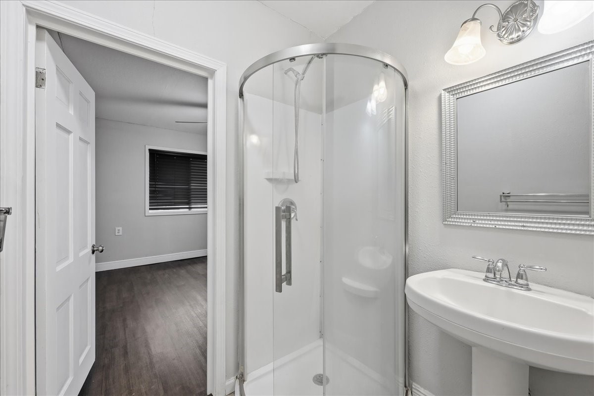 1415 Beagle Road Orange, TX 77632 - Photo 13 of 23 a bathroom with a sink a toilet and shower