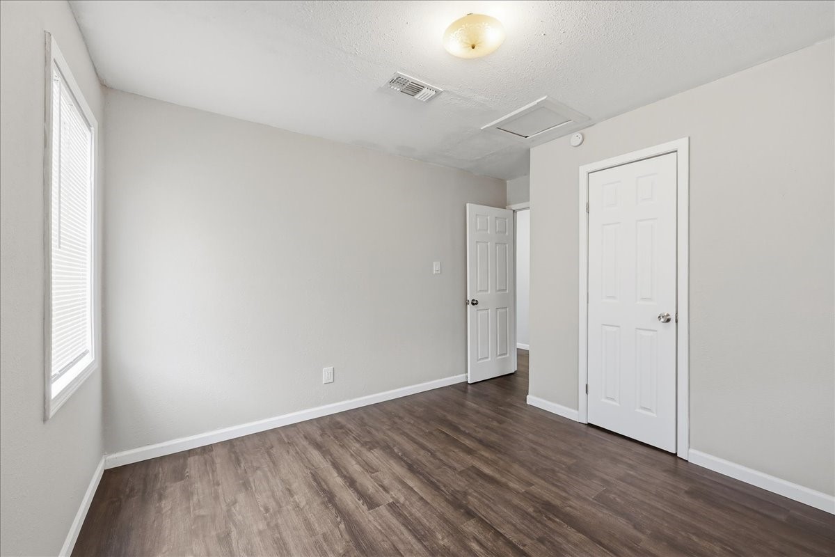 1415 Beagle Road Orange, TX 77632 - Photo 15 of 23 a view of an empty room with wooden floor