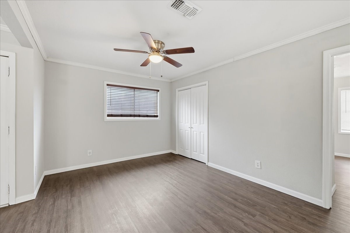 1415 Beagle Road Orange, TX 77632 - Photo 6 of 23 a view of empty room with wooden floor and fan