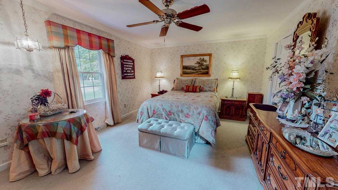 10 Canterbury Drive Roxboro, NC 27573 - Photo 17 of 30 a bedroom with furniture and a bed